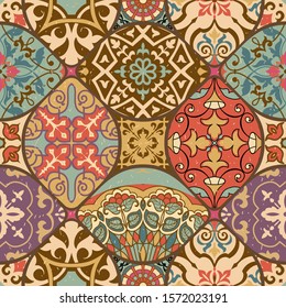 Seamless colorful patchwork tile with Islam, Arabic, Indian, ottoman motifs. Majolica pottery tile. Portuguese and Spain decor. Gaudi mosaic. Ceramic tile in talavera style. Vector illustration