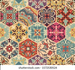 Seamless colorful patchwork tile with Islam, Arabic, Indian, African motifs. Majolica pottery tile. Portuguese and Spain decor. Gaudi mosaic. Ceramic tile in talavera style. Vector illustration