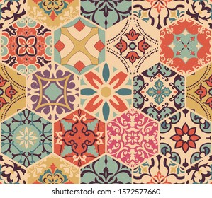 Seamless colorful patchwork tile with Islam, Arabic, Indian, African motifs. Majolica pottery tile. Portuguese and Spain decor. Gaudi mosaic. Ceramic tile in talavera style. Vector illustration