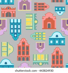 Seamless colorful pattern based on stylized front facades of old houses. Houses of red, blue, yellow and purple color and gray background.