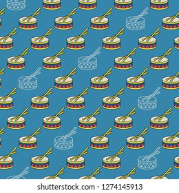 Seamless colorful pattern with carnival drums on blue background.
