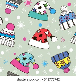 seamless colorful pattern of winter hats and snowflakes in doodle style