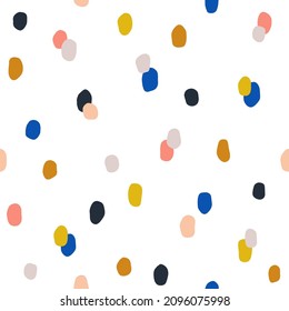 Seamless colorful polka dot pattern. Vector abstract background with random hand drawn spots.