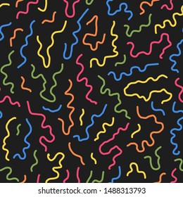 Seamless colorful wavy line pattern in 80s 90s memphis style.Bright curve stripes on black background.Trendy hand drawn  print.Vector