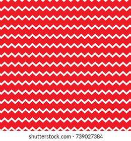 Seamless colorful zigzag chevron pattern background with red and white jagged lines.