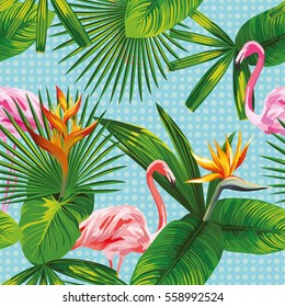 Seamless composition of beautiful pink flamingo birds, tropical plants and flowers on a sky blue circles background. Vector illustration pattern wallpaper