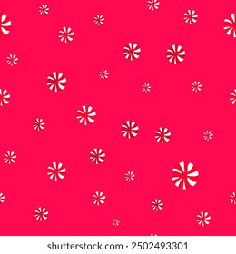 Seamless confetti pattern of red candies on a red background.