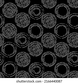 Seamless contrast texture of hand-drawn abstract circles from broken lines, dashes on a black square background. Vector illustration for printing on paper, fabric, packaging, wallpaper.