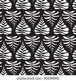 Seamless creative hand-drawn pattern composed of stylized leaves in black and white colors. Vector illustration.