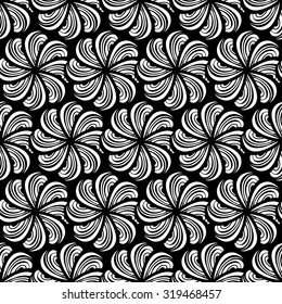 Seamless creative hand-drawn pattern composed of wavy stylized flowers in black and white colors. Vector illustration.