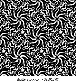 Seamless creative hand-drawn pattern composed of wavy stylized flowers in black and white colors. Vector illustration.