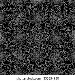 Seamless creative hand-drawn pattern of stylized flowers in black and white colors. Vector illustration.