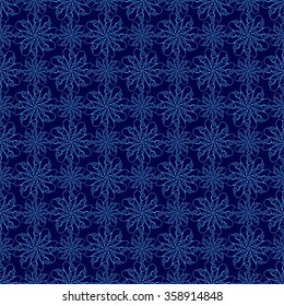 Seamless creative hand-drawn pattern of stylized flowers in bright cyan and indigo colors. Vector illustration.