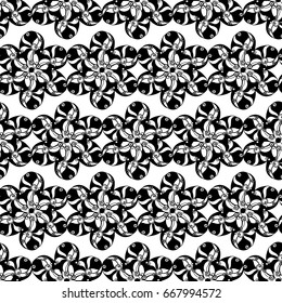 Seamless creative hand-drawn pattern of stylized flowers in black and white colors. Vector illustration.