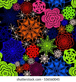 Seamless crochet flowers pattern. Crochet blanket of floral elements, handmade, multicolored knitted snowflakes, cozy blanket.