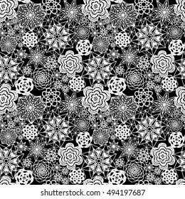 Seamless crochet flowers pattern. New Year, Christmas background. Crochet blanket of floral elements, handmade, multicolored knitted snowflakes, cozy blanket.