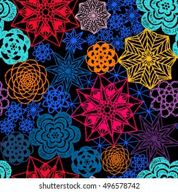 Seamless crochet flowers pattern. New Year, Christmas background. Crochet blanket of floral elements, handmade, multicolored knitted snowflakes, cozy blanket.