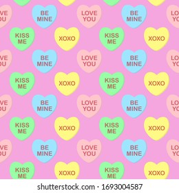Seamless cute colorful vector valentine pattern with pastel candy hearts with text on pink background.  