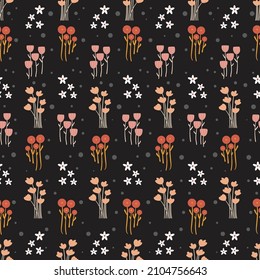 Seamless cute floral pattern of small flowers on black background