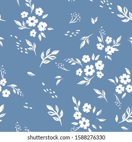 Seamless cute floral vector pattern background. Flower pattern on blue background