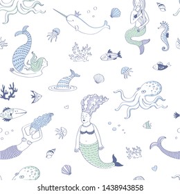 Seamless cute pattern with mermaids and other underwater inhabitants in blue