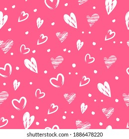 Seamless cute pattern with white hand-drawn hearts on a pink background for Valentine's Day.