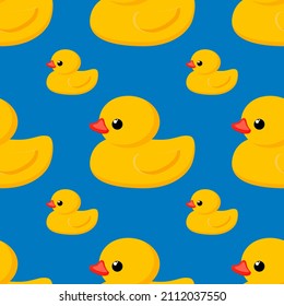 Seamless cute pattern. Yellow rubber duck on a blue background. Fashion textiles and decorative fabrics. Vector.