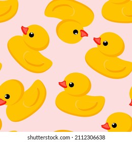 Seamless cute pattern. Yellow rubber duck on a delicate pink background. Fashion textiles and decorative fabrics. Vector.