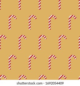 Impresionante adorable patrón vectorial de Navidad retro con caramelos rayados rojos y blancos en fondo dorado. Papel de regalo, interior, tela, tela o diseño web.