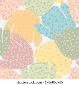 Seamless cute vector design of knitted ornamental colorful winter sweaters