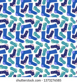 Seamless cyan and blue socks vector pattern on white background. Hand drawn stocking in a shades of blue. Perfect for wallpaper or fabric.