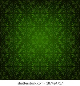 Seamless damask ornament of floral elements on green background