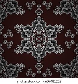 Seamless damask pattern background for wallpaper design in the style of Baroque. White pattern on brown background with white elements. Ornate vector decoration.