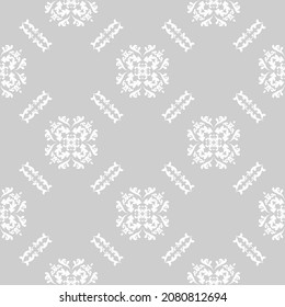 Seamless damask white pattern on gray background. Modern arabic pattern. Vector pattern with ornament. Background, wallpaper, wrapping, textile template.
