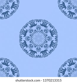 Seamless dark blue decorative floral ornament on blue background. Seamless wallpaper pattern. Trendy wallpaper pattern