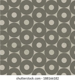 Seamless dark pattern of beige circles on a white paper