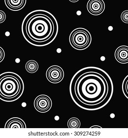 Seamless decorative background with black and white circles and dots