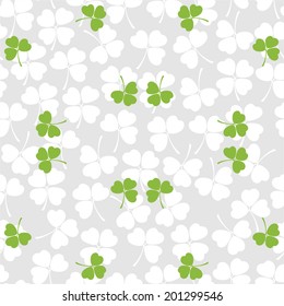 Seamless decorative floral pattern with clover, shamrocks 