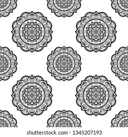 Seamless decorative ornament in ethnic oriental style. Circular pattern in form of mandala for Henna, Mehndi, tattoo, decoration.