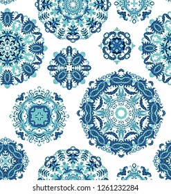 Seamless decorative paisley pattern with ornamental rosettes - mandala on white background