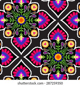 seamless decorative pattern with floral folk elements. Mexican style, colorful tiles, classic textile motif. ethnic colorful fashion or interior pattern.