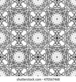 Seamless decorative pattern. Ornament with mosaic elements. Vintage floral styling to design cards, corporate identity, textiles. Kaleidoscope. Graphics. Adult coloring