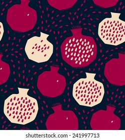 Seamless decorative pattern with pomegranates. Sliced pomegranates and seeds on dark background