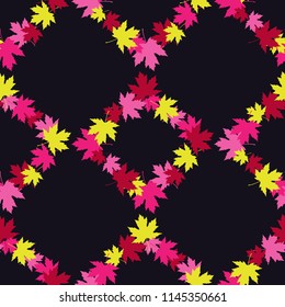Seamless decorative vector background with maple leaves. Indian summer. Texture of rhombus. Textile rapport.