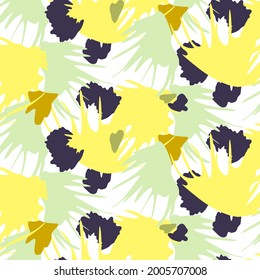 Seamless delicate abstract floral pattern, yellow, green, blue flower petals scattered across the canvas, on a white background. Design of textiles, wallpaper, fabrics, printing.
