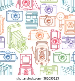 seamless with different sketch vintage colorful cameras. hand-drawn illustration