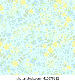 Seamless ditsy. Floral pattern. Flowers on blue background. Vector illustration.