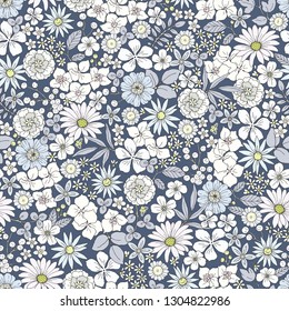 Seamless ditsy floral print with smalle flowers, branches and leaves. Vector pattern gray, blue and indigo colors, illustration in vintage style on dark blue background.