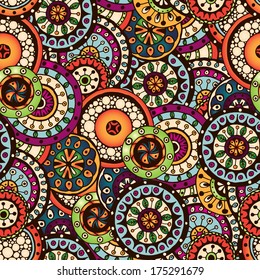 Seamless doodle flower background in vector. Circles ethnic floral pattern. Used Clipping mask for easy editing.