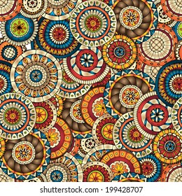 Seamless doodle flower background in vector with doodles, flowers and cucumbers. Circles ethnic floral pattern. Used Clipping mask for easy editing.